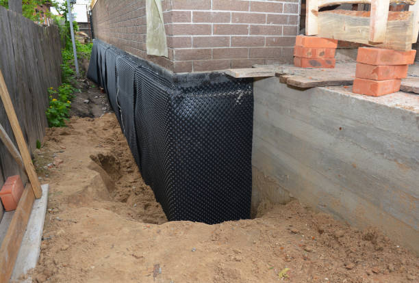 Happy homeowners after waterproofing job in Grand Bay